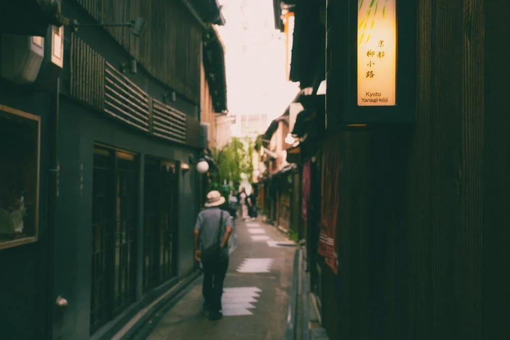 An early walker in a narrow lane