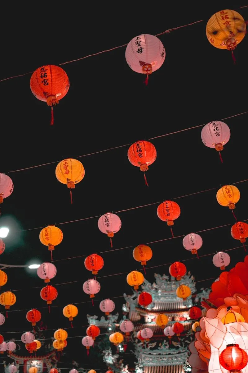 Lanterns strung over a temple forecourt