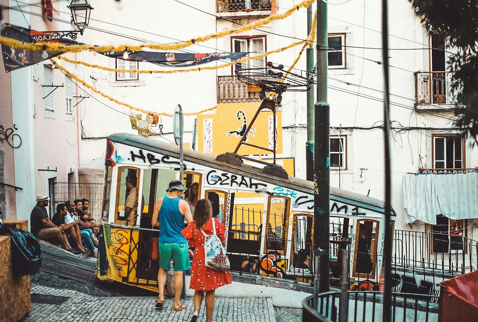 Two friends walking towards a tram